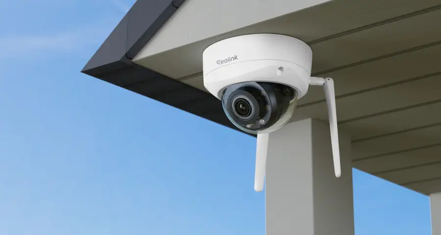 Dome camera mounted under a roofline